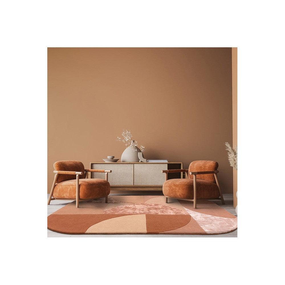 Asiatic Oval Earth Designer Rug featuring geometric oval pattern in terracotta, burnt orange and blush on warm terracotta background, hand-tufted wool