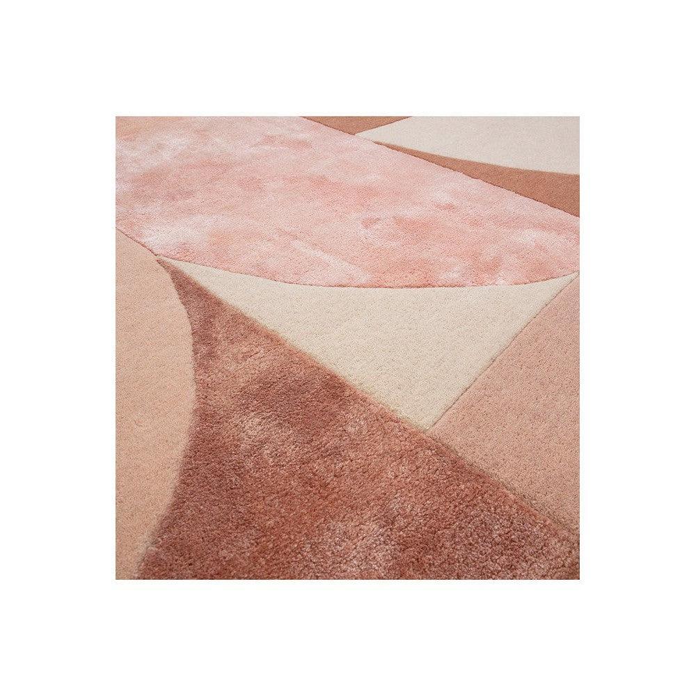 Asiatic Oval Earth Designer Rug featuring geometric patchwork in blush pink, dusty rose, cream on pale beige, hand-tufted wool