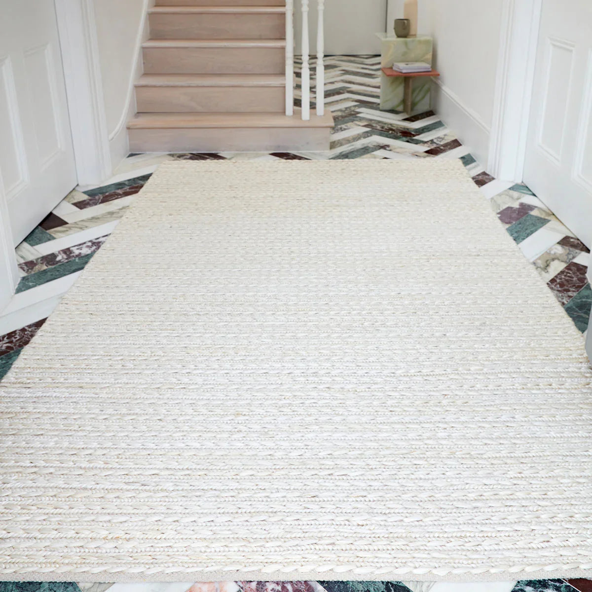 Asiatic Oakley Blonde Designer Rug featuring textured braided weave in cream/ivory on pale background, hand-woven wool