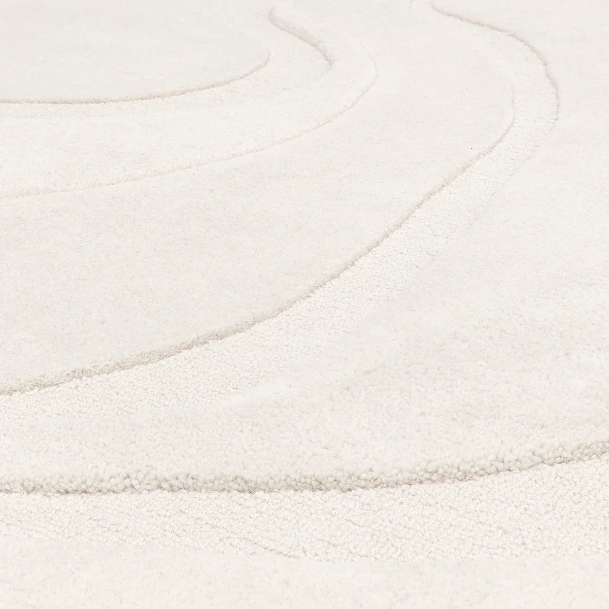 Asiatic Olsen Glide Designer Rug featuring concentric circle pattern in cream and ivory on pale beige field, hand-tufted wool