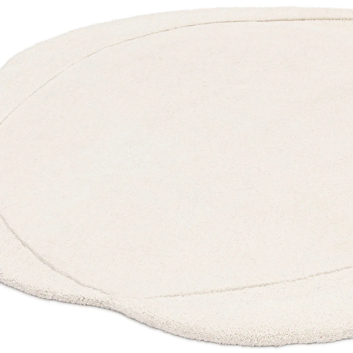 Asiatic Olsen Ridge Designer Rug featuring round shag design in ivory/cream on pale background, hand-tufted wool