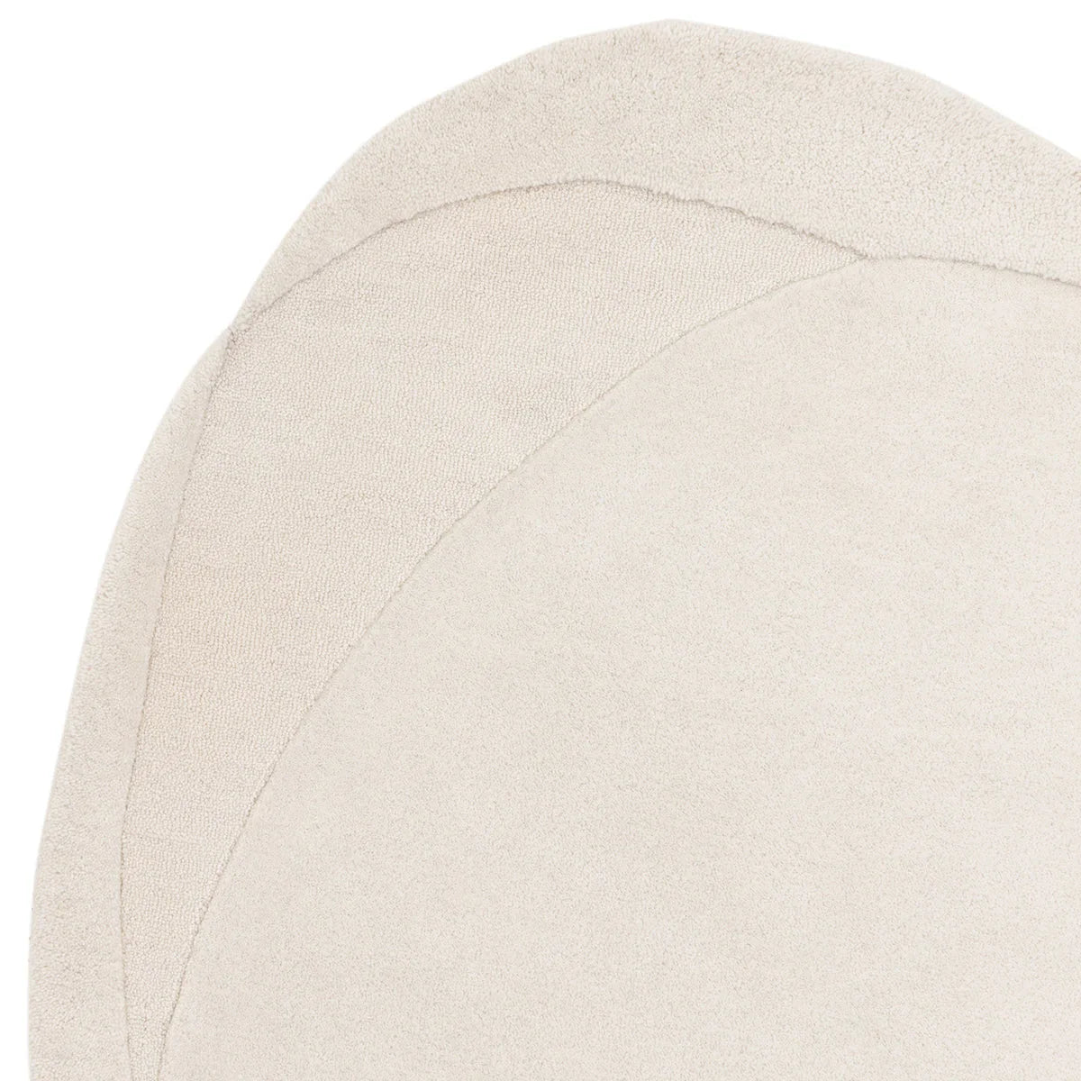 Asiatic Olsen Ridge Designer Rug featuring overlapping arc pattern in cream and beige on soft ivory background, hand-tufted wool