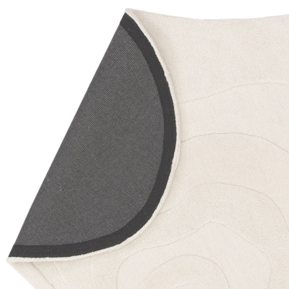 Asiatic Olsen Surge Designer Rug featuring quilted circular pattern in cream with charcoal backing and black edge trim, hand-tufted wool