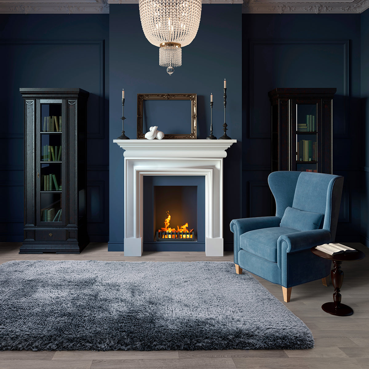 Cozy living room with a fireplace, blue armchair, and decorative elements.