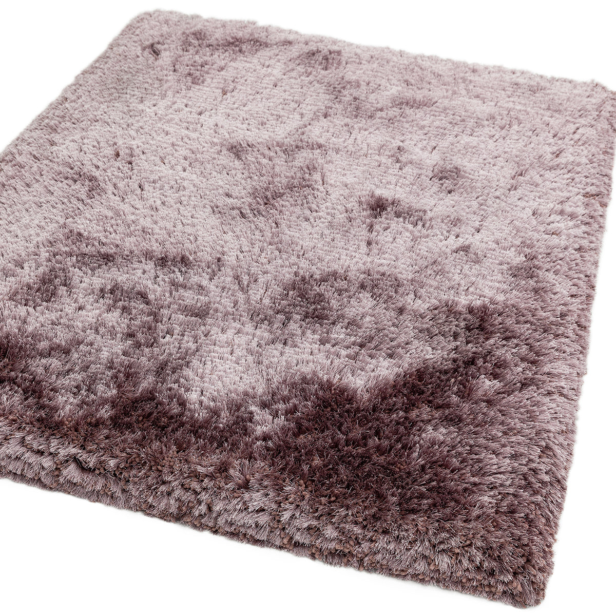 Fluffy pinkish-purple rug on a white background