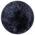 Asiatic Plush Navy Round round rug styled in a living room