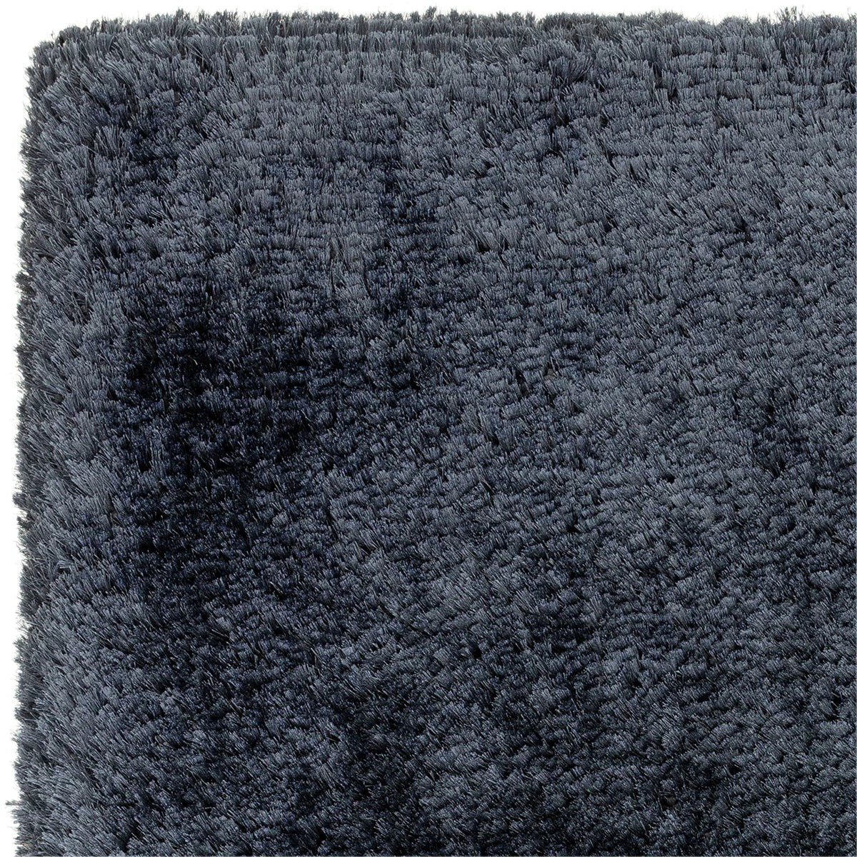 Asiatic Plush Navy Designer Rug featuring solid navy shaggy texture