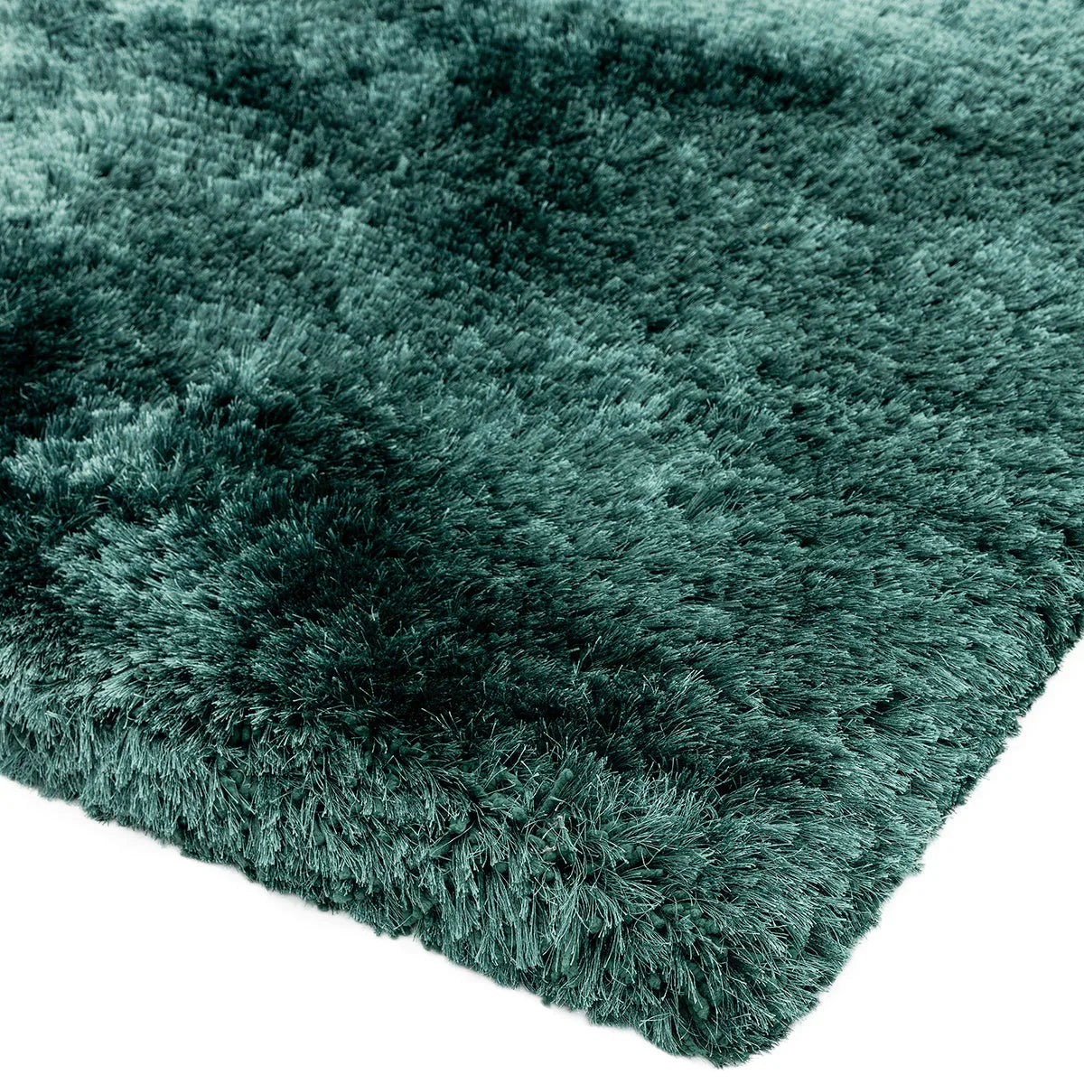 Asiatic Plush Petrol Designer Rug featuring plush shag texture in petrol teal on white background, machine-made polyester