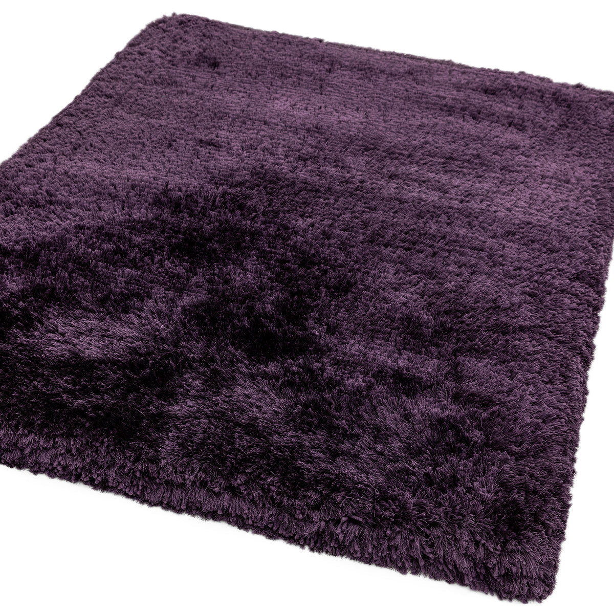 Purple shaggy rug on a white background