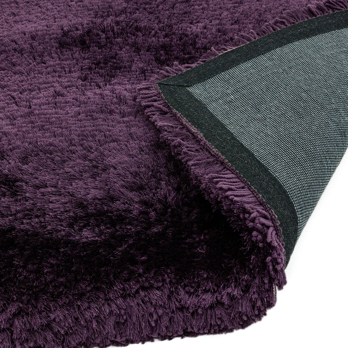Asiatic Plush Purple Designer Rug featuring plush shag in plum purple with charcoal-grey backing and fringe, hand-tufted wool