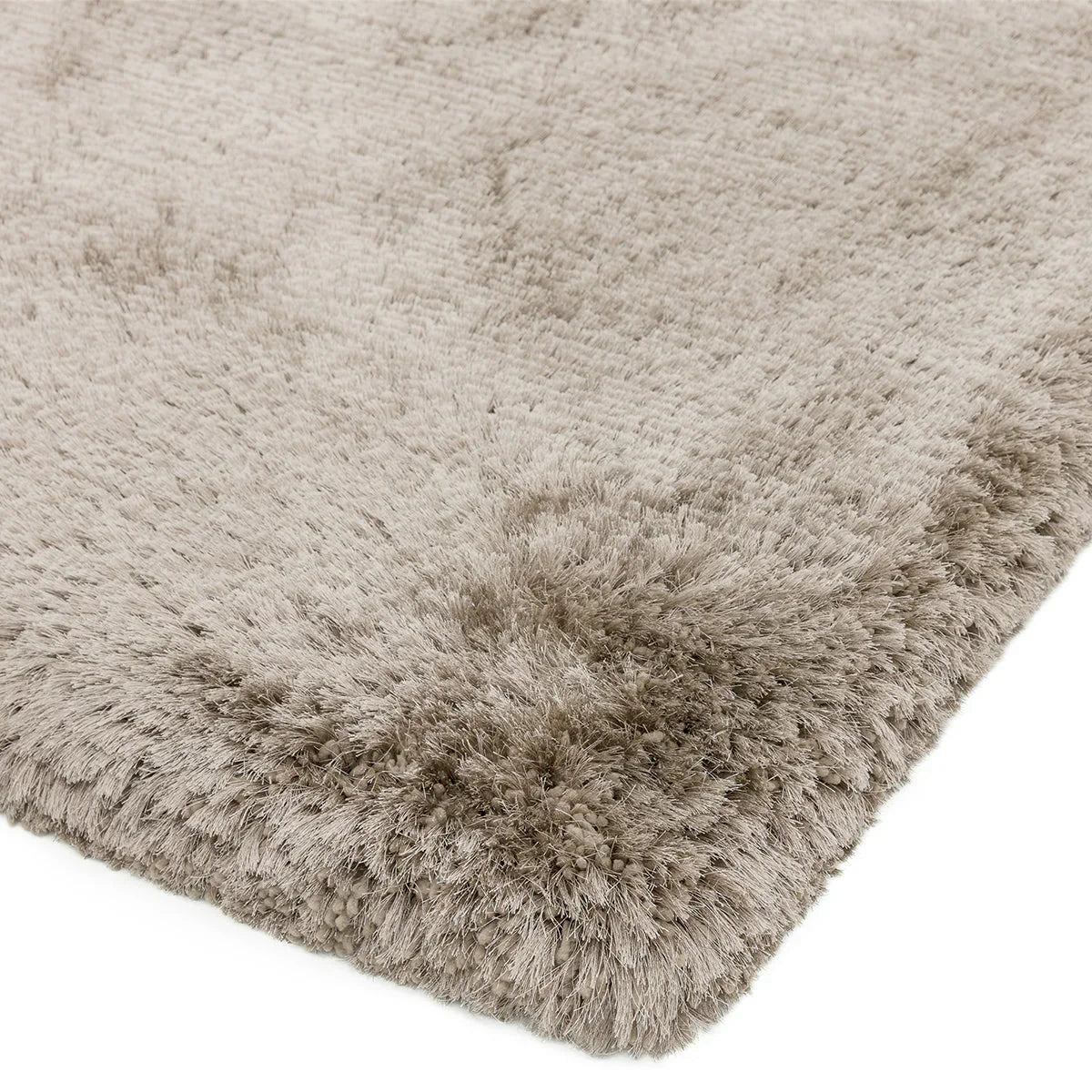 Asiatic Plush Sand Designer Rug featuring soft shag pile in sandy beige on neutral backdrop