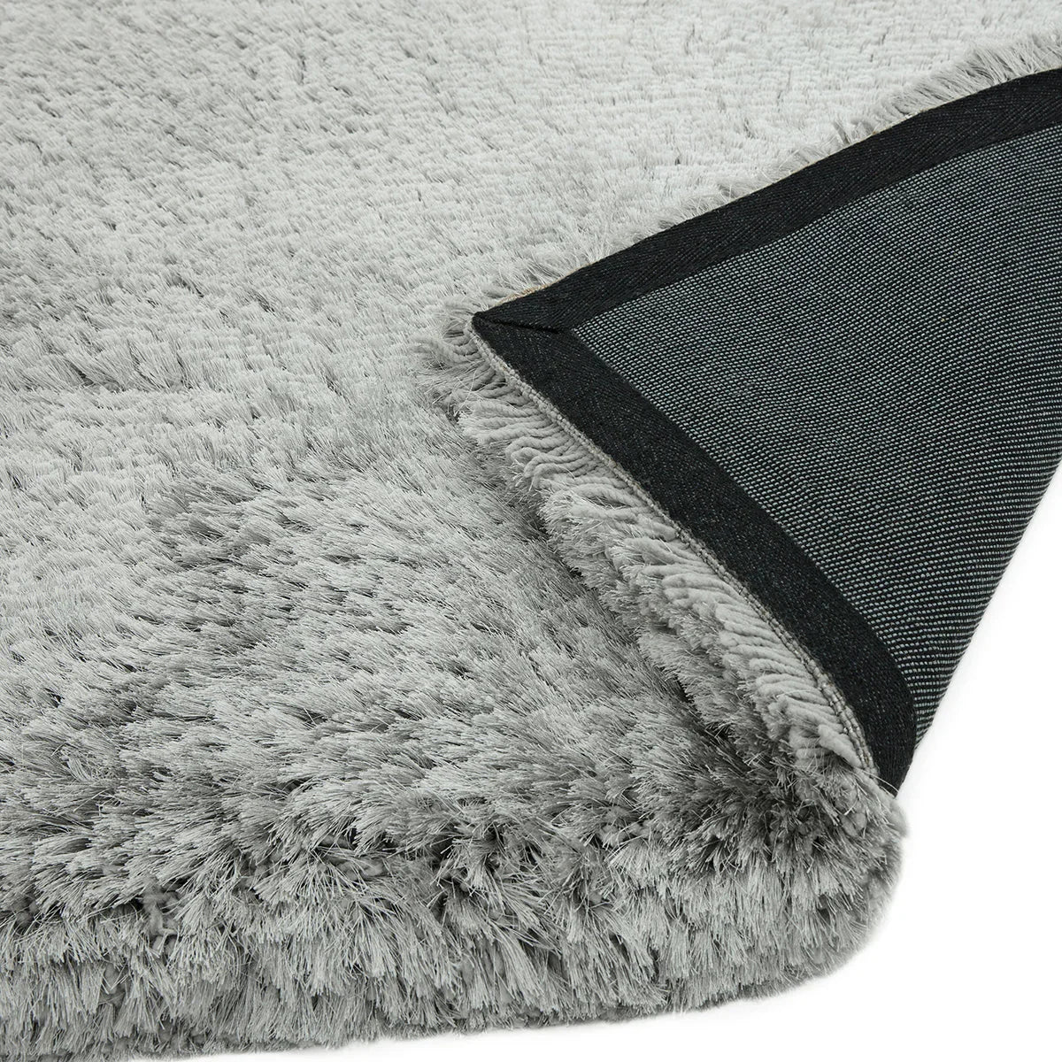 Asiatic Plush Silver Designer Rug featuring solid shag in silver/grey with black backing, machine-made synthetic fibres