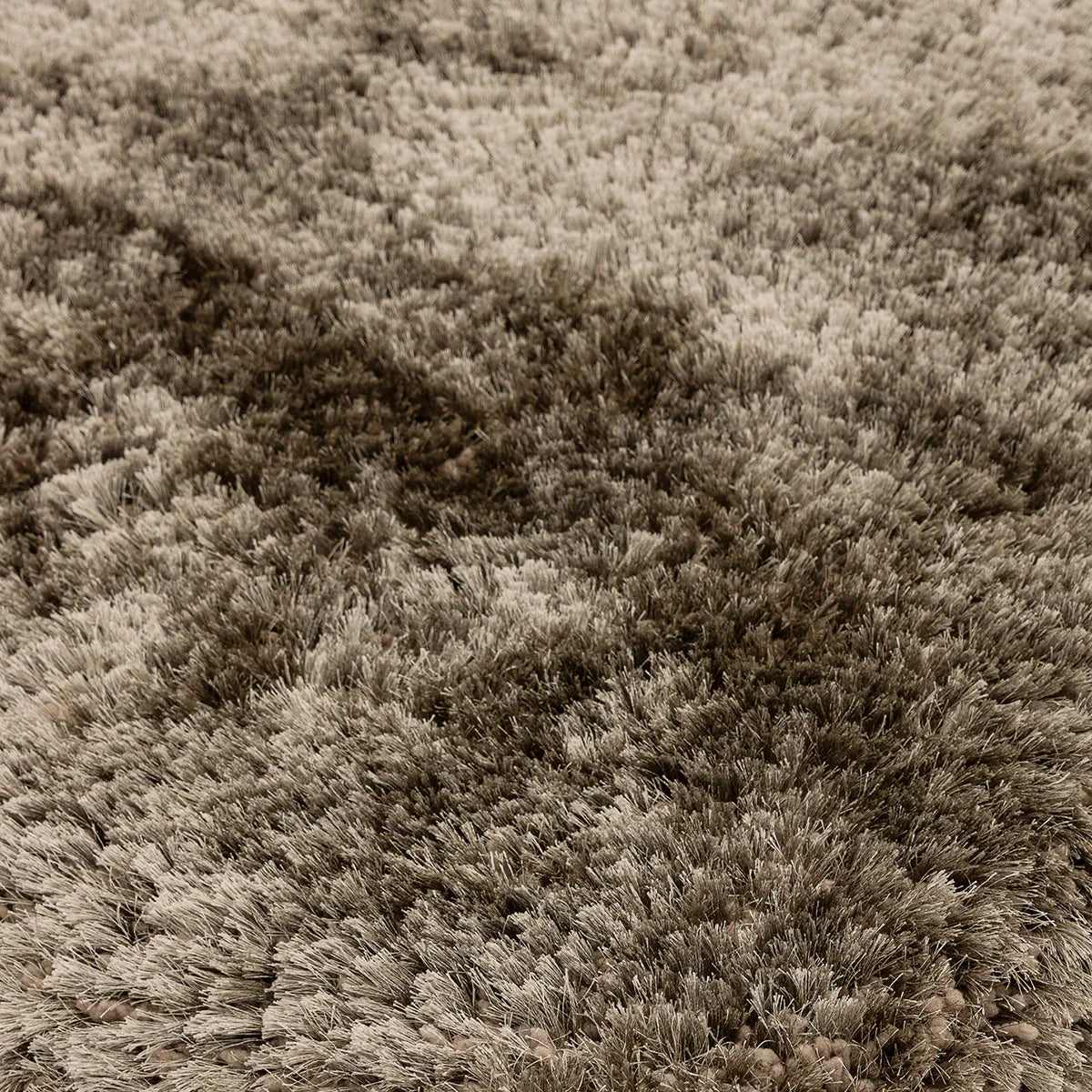 Asiatic Plush Taupe Round Designer Rug featuring plush shag texture in taupe, beige and cocoa on taupe background, tufted wool