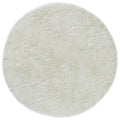 Asiatic Plush White Round round rug styled in a living room