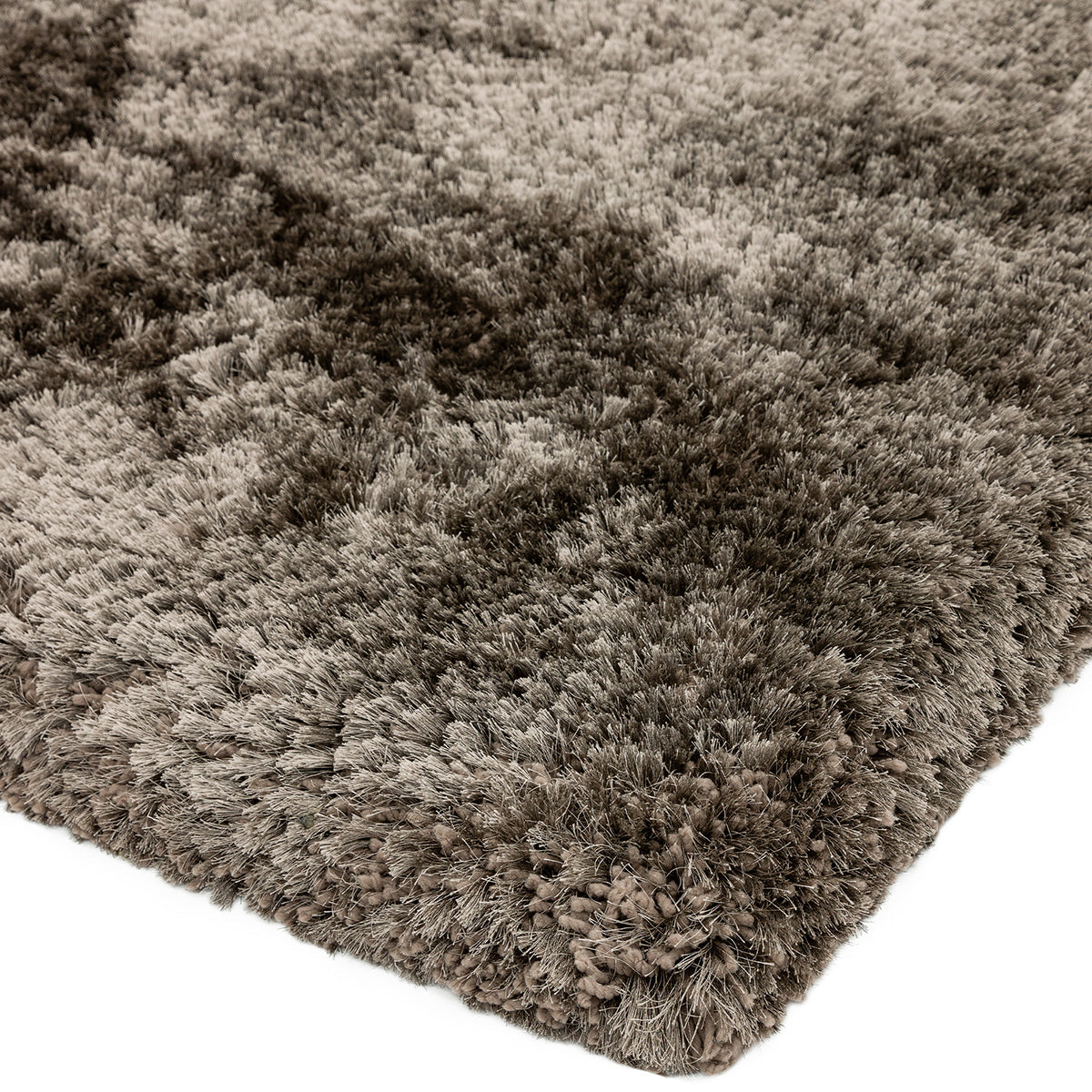 Close-up of a brown shaggy rug on a white background