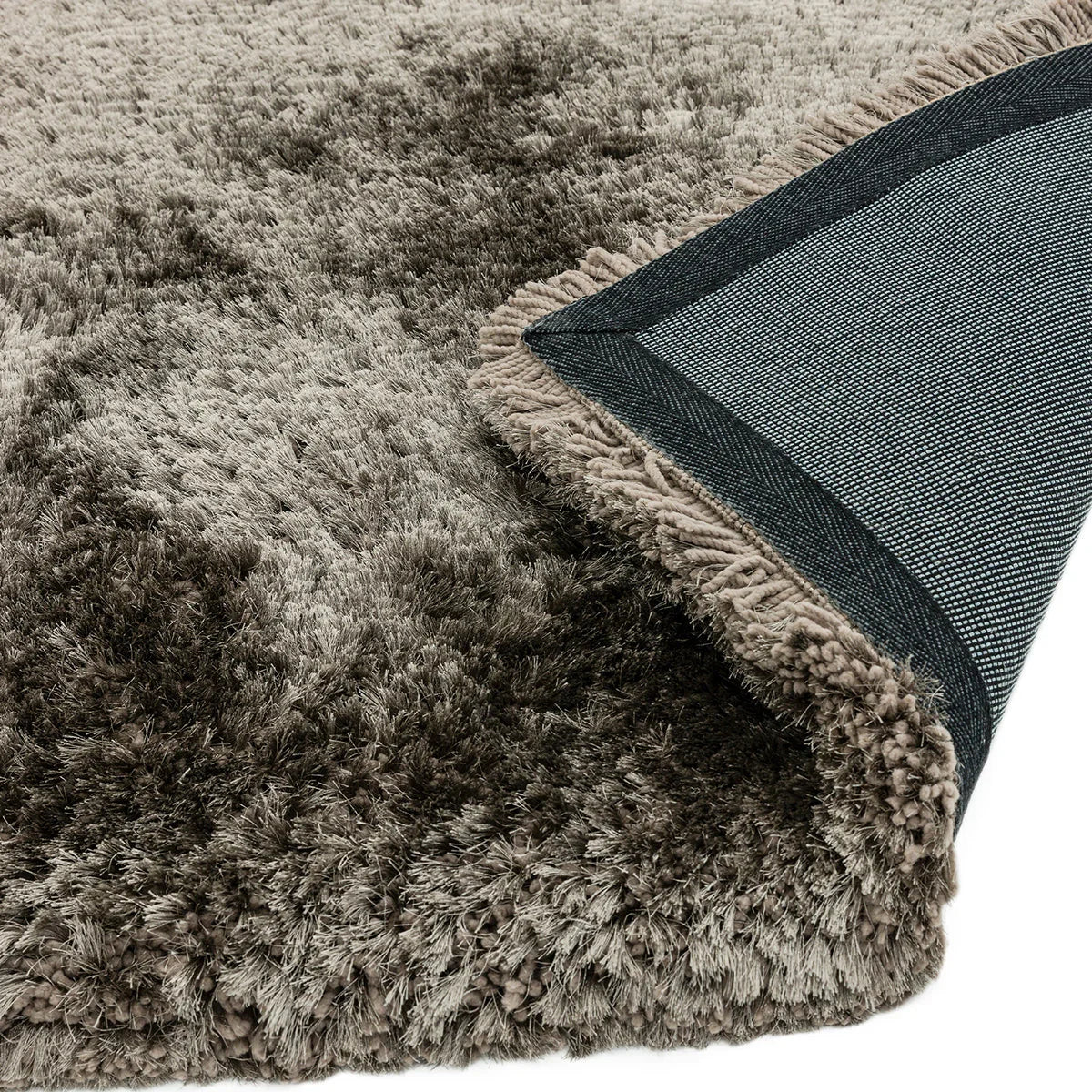 Asiatic Plush Zinc Designer Rug featuring plush shag in taupe, beige, charcoal and cream on dark blue back, hand-tufted wool