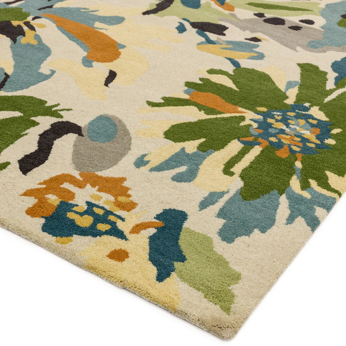Asiatic Reef Floral Green rug featuring vibrant floral motif in emerald green, teal, mustard and blue on cream background, hand-tufted wool