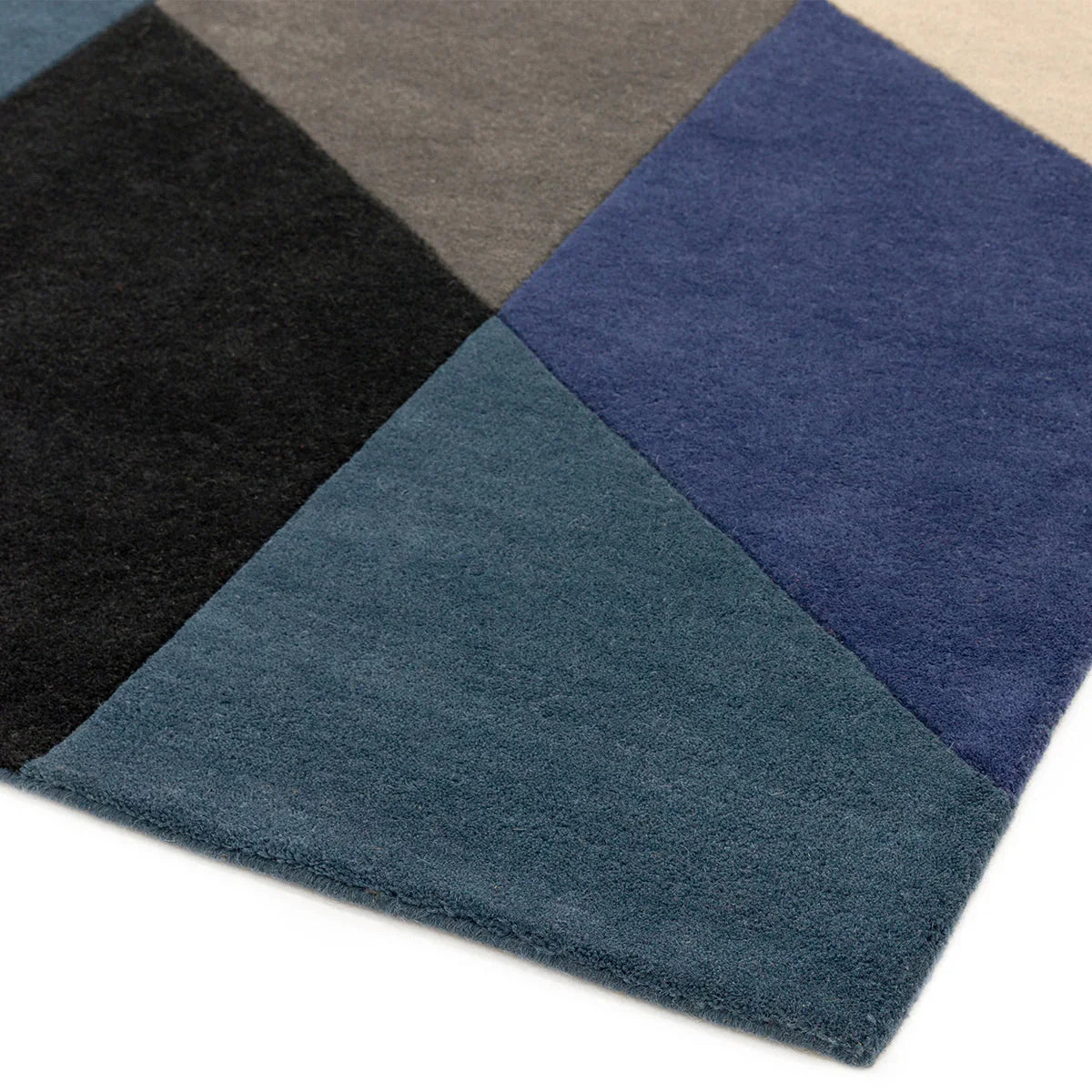 Asiatic Reef 13 Big Geo Blue Designer Rug featuring color-block geometric pattern in navy, royal blue, teal and grey on blue-grey background, hand-tufted wool