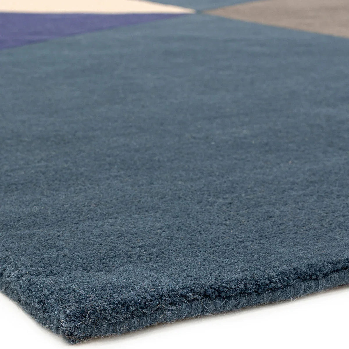 Asiatic Reef Big Geo Blue rug featuring geometric reef pattern in navy blue, steel blue, and cornflower blue on indigo background, hand-tufted wool
