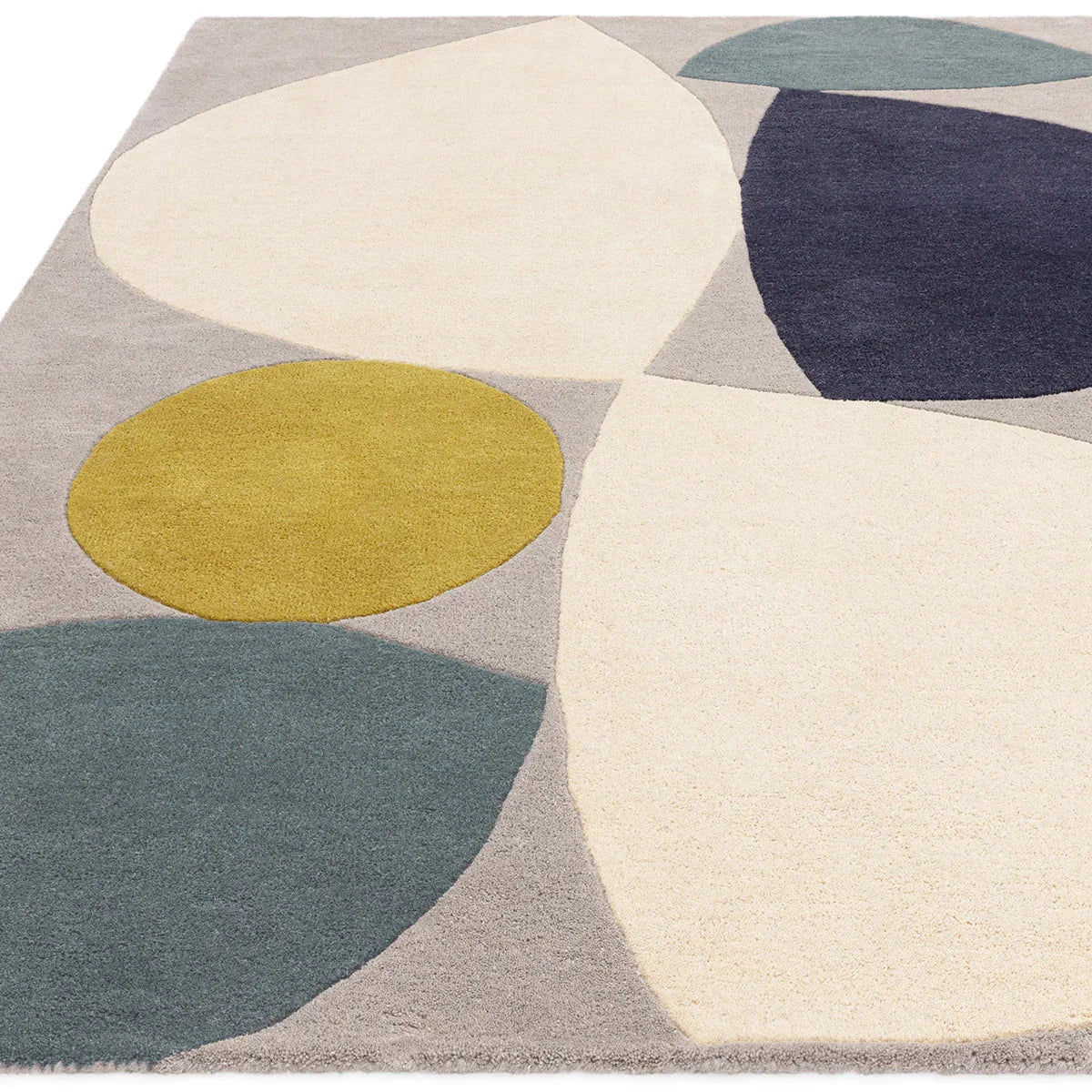 Asiatic Reef 25 Mid Century Teal rug featuring abstract circular blocks in teal, navy, mustard and cream on light beige, hand-tufted wool