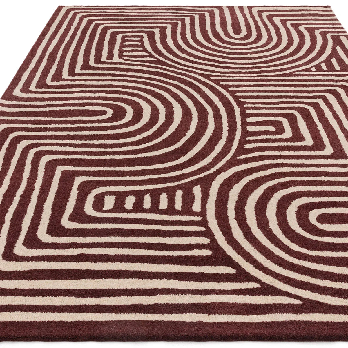 Asiatic Reef Curve Plum rug featuring reef/maze pattern in plum and beige on ivory background, machine-made polypropylene