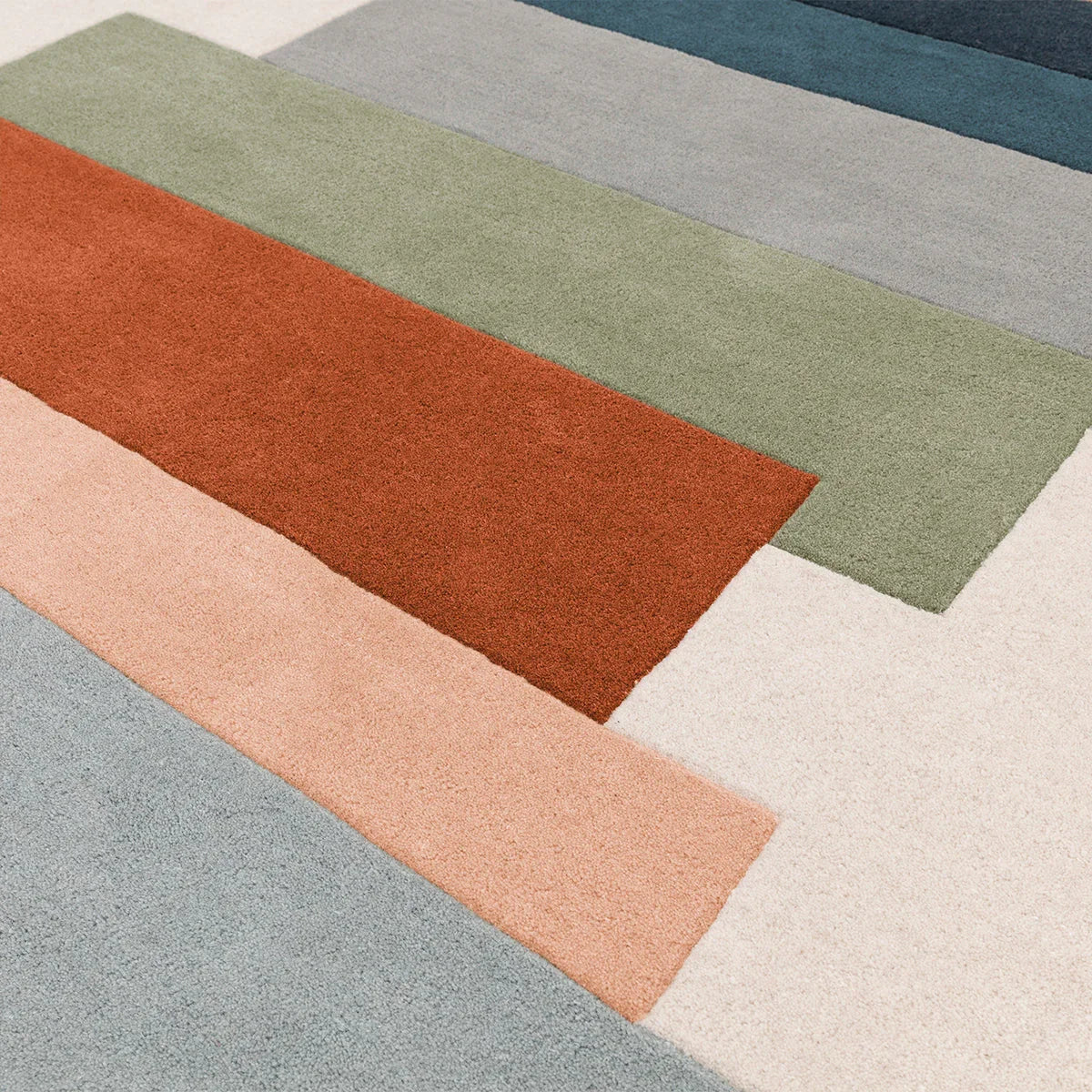 Asiatic Reef 32 Stacks Green Rug featuring colour-block stripes in sage green, coral, peach on cream background, hand-tufted wool