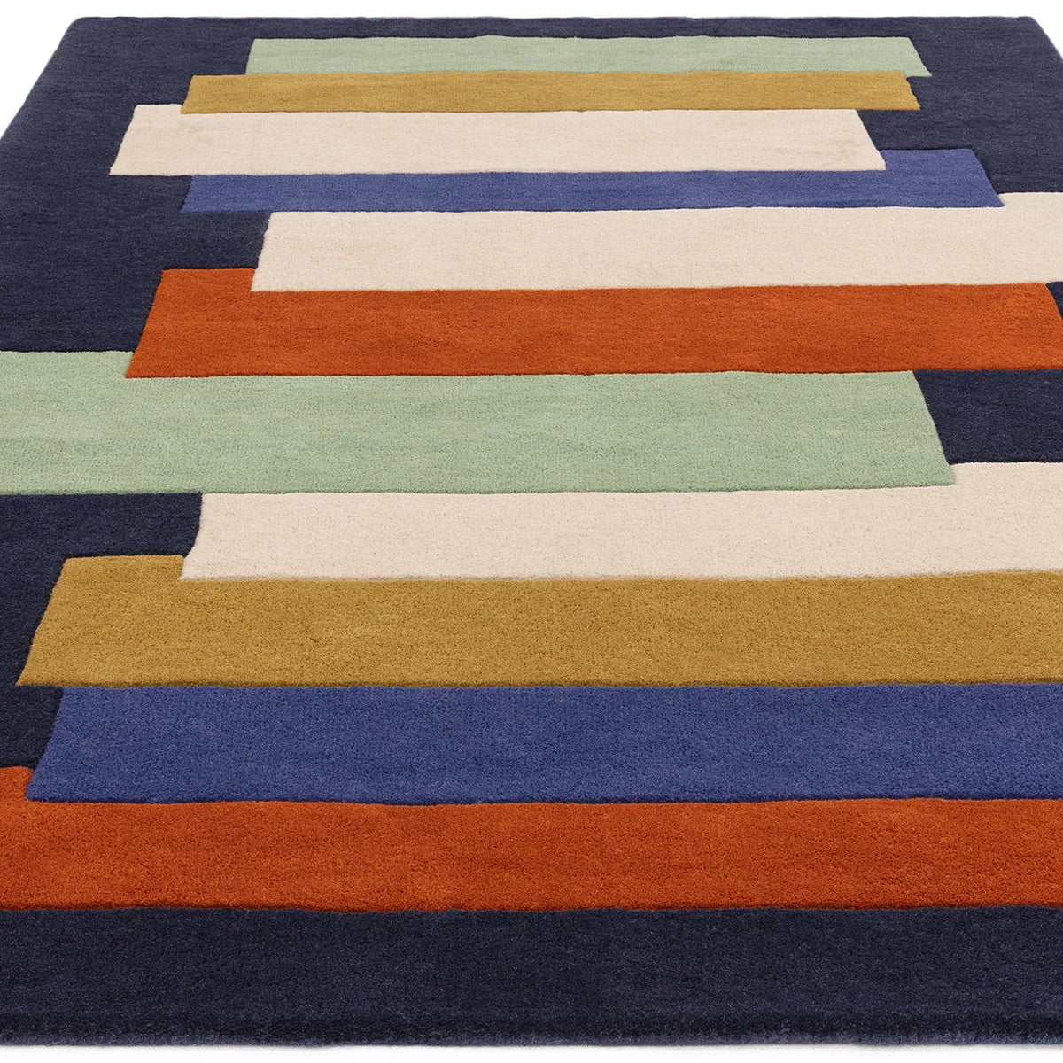 Asiatic Reef Stacks Multi Designer Rug featuring geometric stacked-bars in navy, mustard, burnt orange, cream, sage on dark navy background, hand-tufted wool
