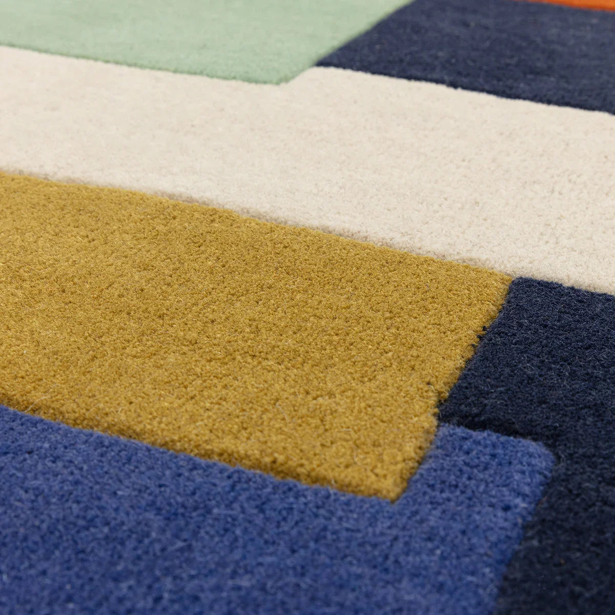 Asiatic Reef Stacks Multi Designer Rug featuring geometric block pattern in navy blue, mustard yellow, cream and sage green on multicolour background, hand-tufted wool