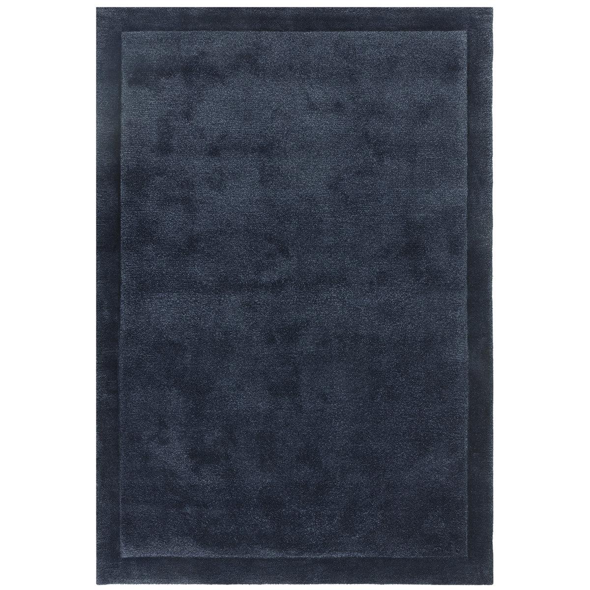 Dark blue rectangular rug on a white background