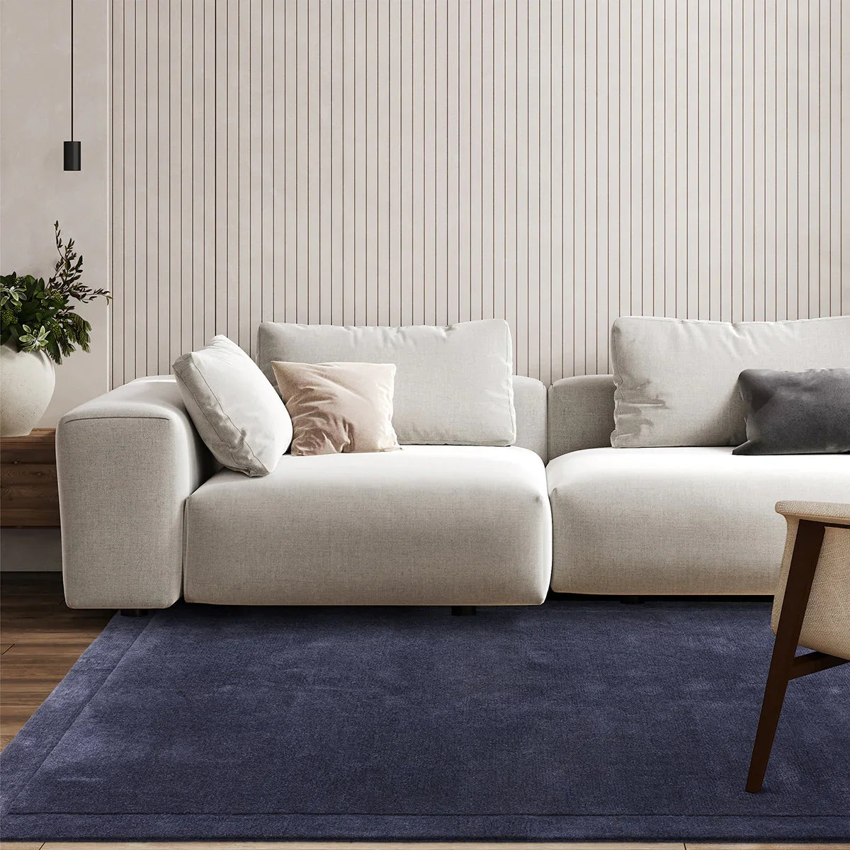Asiatic Rise Navy Designer Rug featuring solid minimalist design in navy blue on warm beige floor, hand-tufted wool