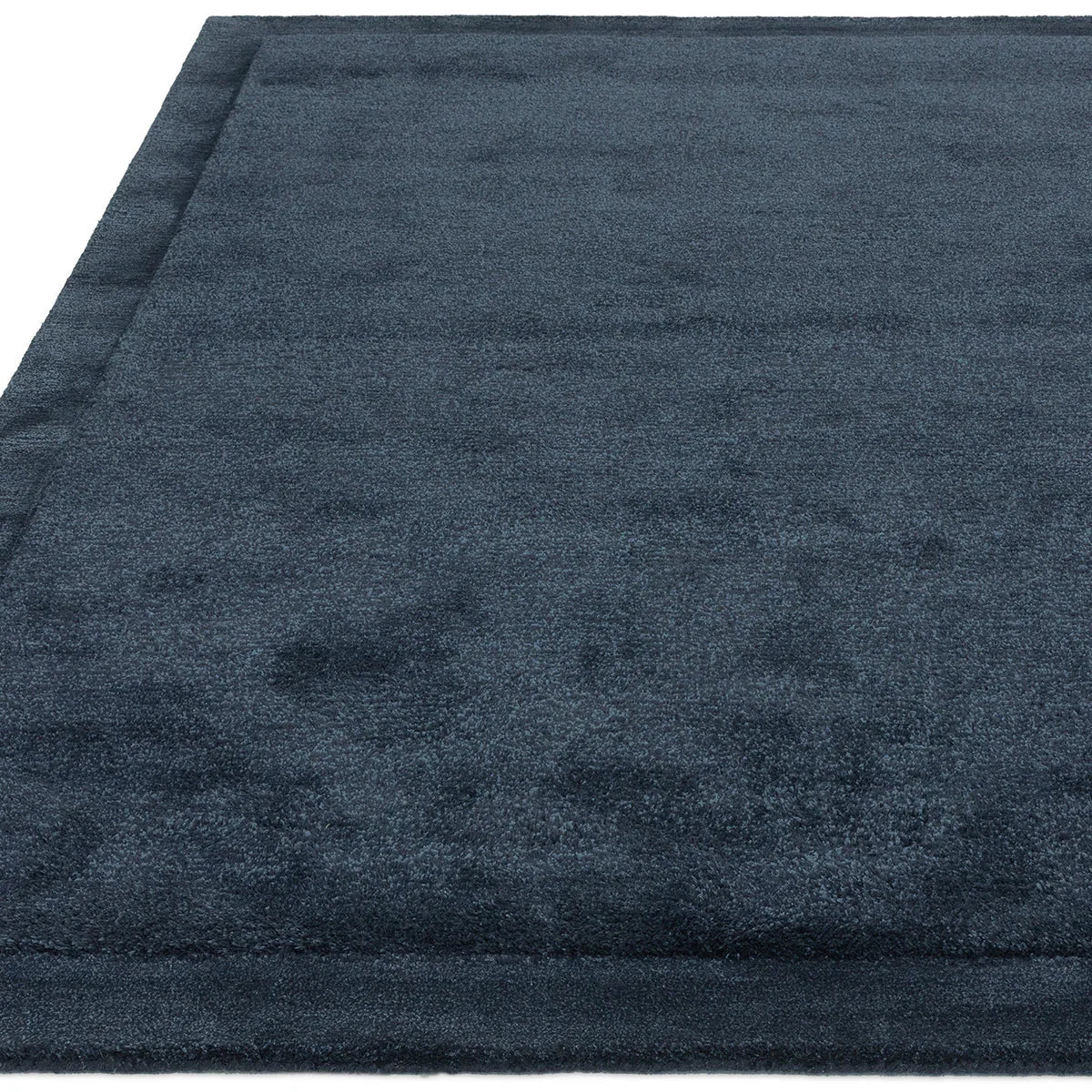 Asiatic Rise Navy Designer Rug featuring solid plain texture in navy blue on white background, machine-made wool blend
