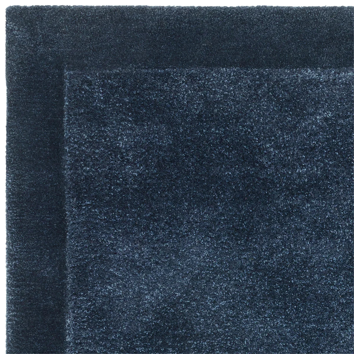 Asiatic Rise Navy Designer Rug featuring bordered navy field on white background, machine-made wool