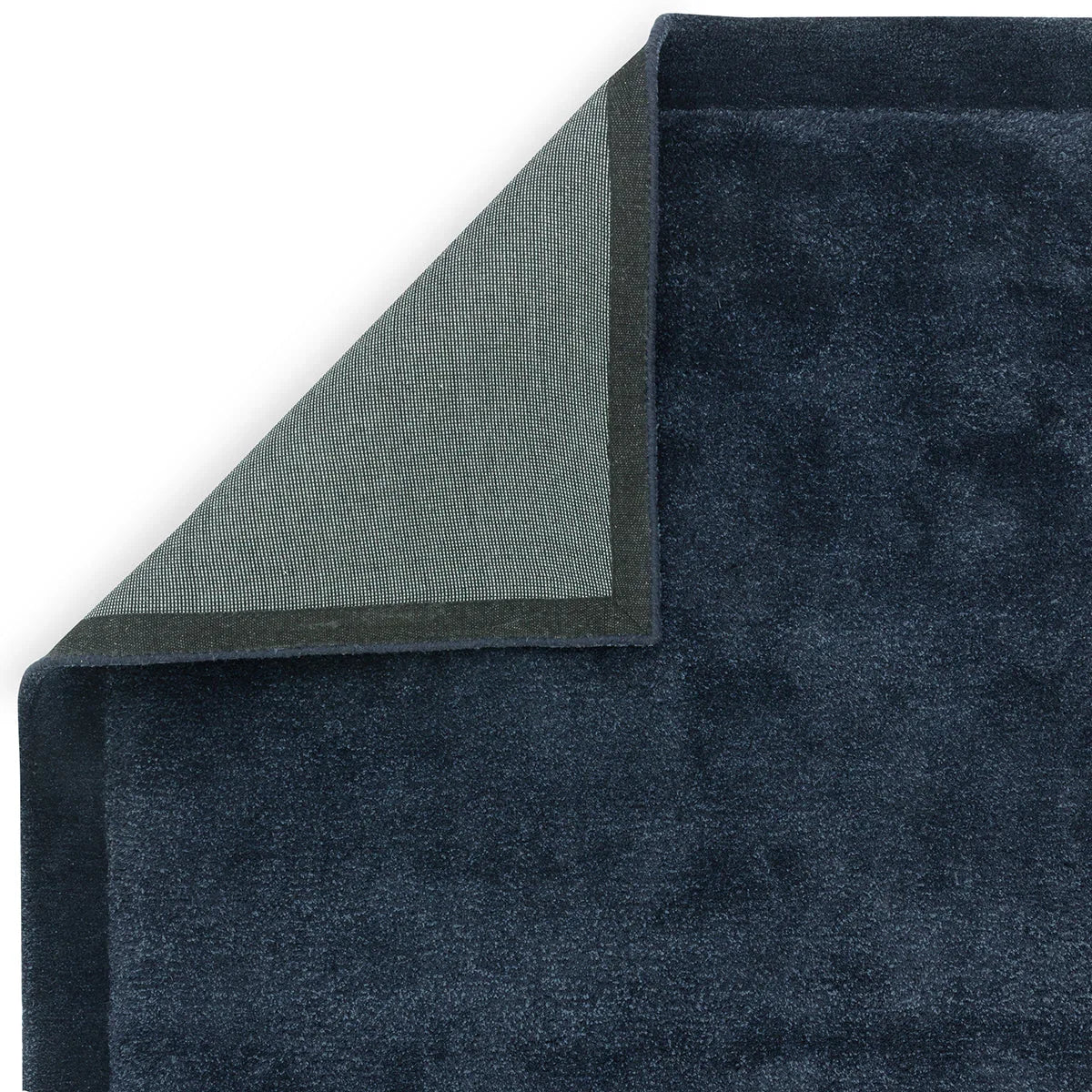 Asiatic Rise Navy Designer Rug featuring solid navy pile on light grey underside, power-loomed wool