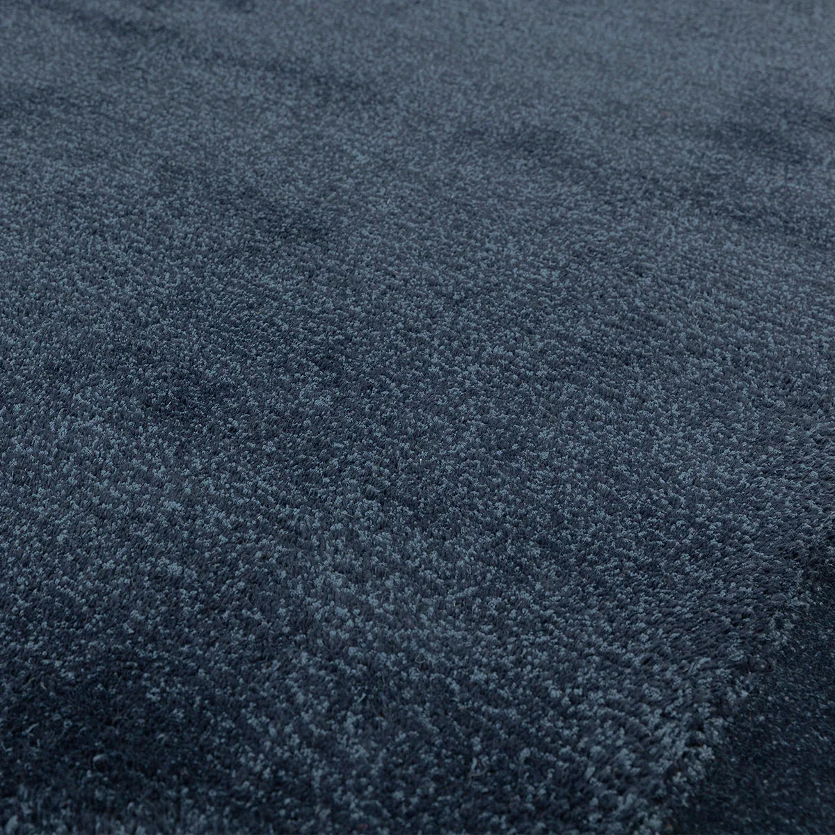 Asiatic Rise Navy Designer Rug featuring solid navy pile on deep navy background, hand-tufted wool