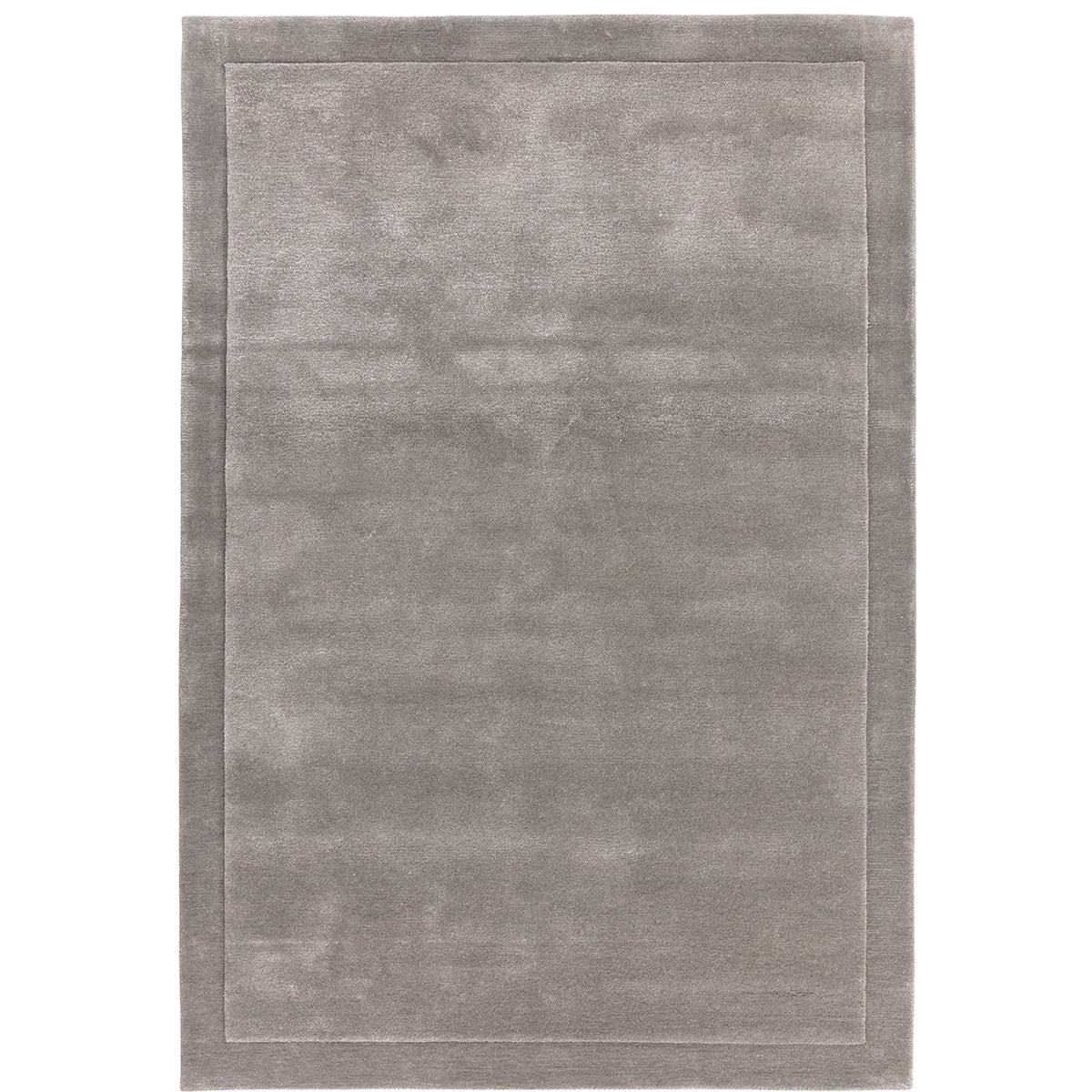 Gray area rug with a subtle pattern on a white background