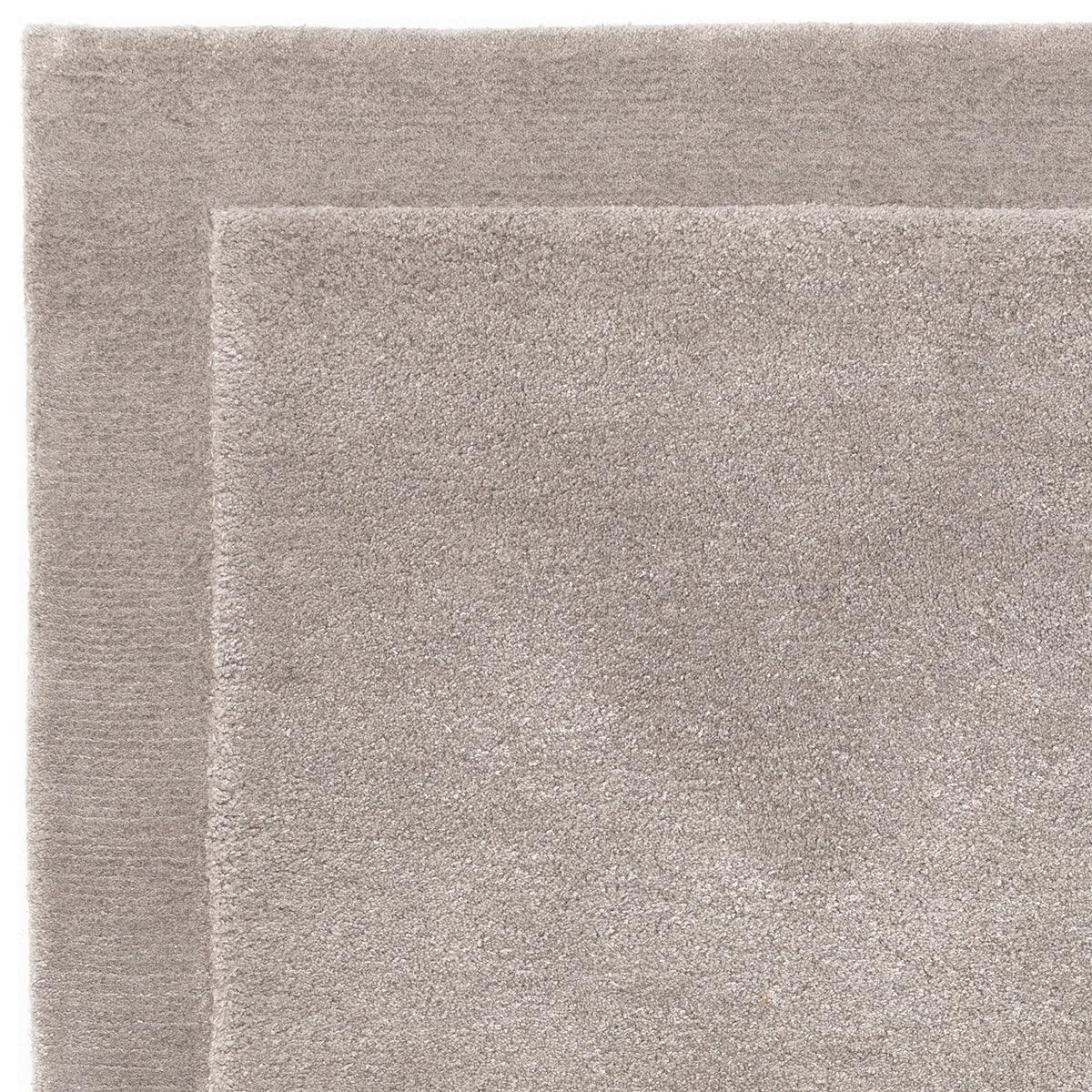 Asiatic Rise Silver Designer Rug featuring subtle border pattern in silver and grey on pale background, machine-made polypropylene