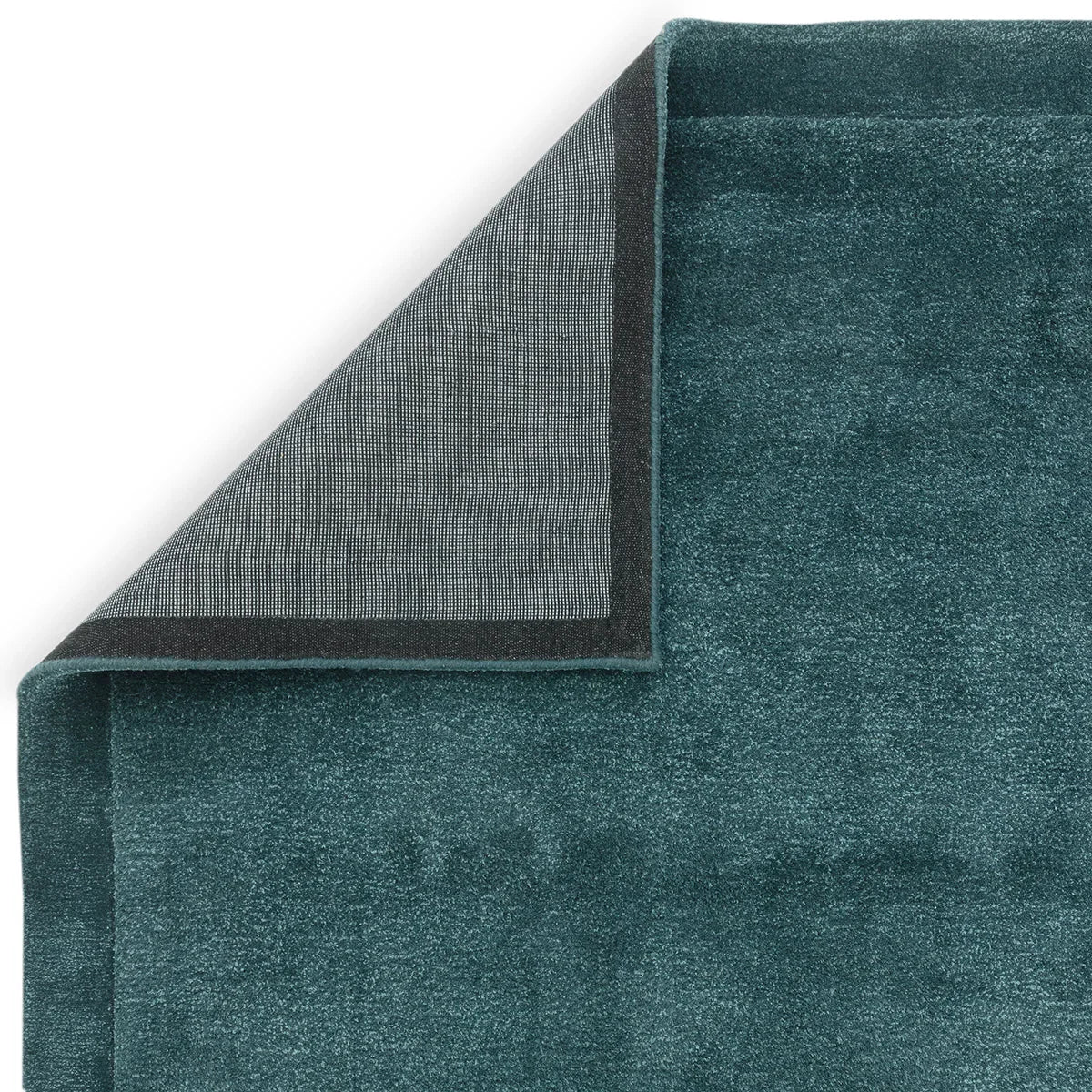 Asiatic Rise Teal Designer Rug featuring solid textured pattern in teal on teal background, machine-woven wool