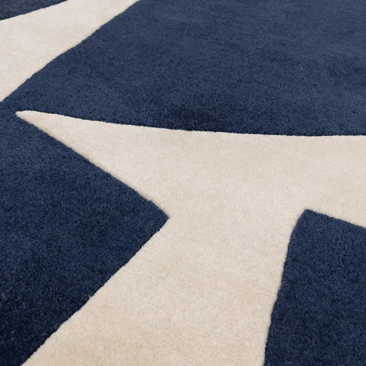 Asiatic Romy Kite Blue Rug with geometric kite pattern in navy blue and cream on beige, construction unknown, material unknown