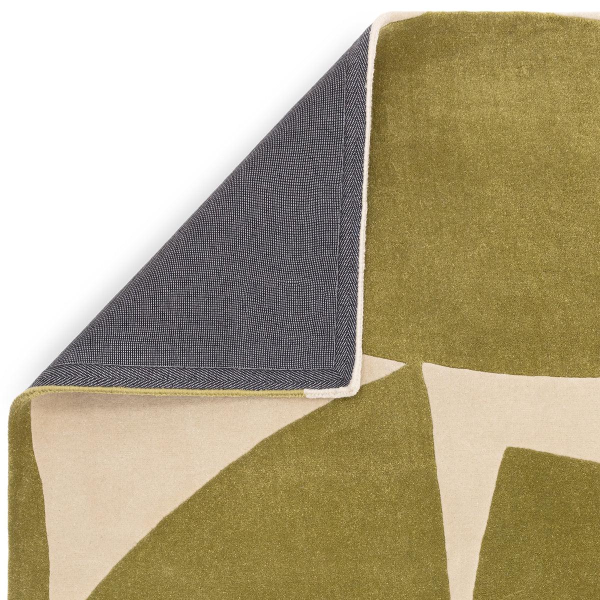 Asiatic Romy Kite Sage rug featuring geometric blocks in olive and cream on sage background, navy reverse fabric