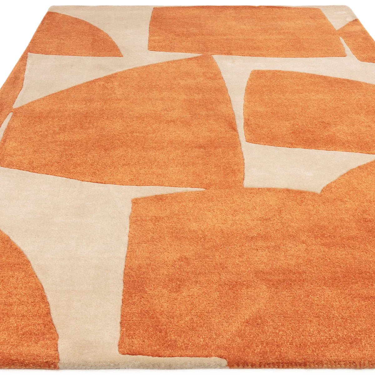 Asiatic Romy Kite Orange rug featuring abstract geometric kite pattern in burnt orange and cream on beige background