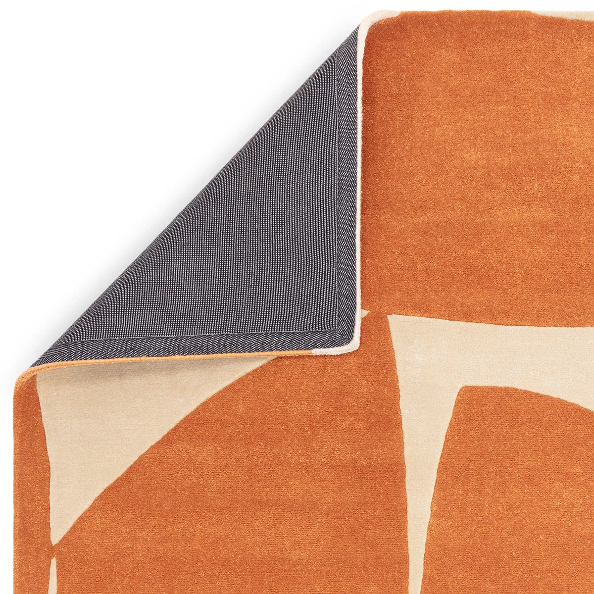 Asiatic Romy Kite Orange Rug featuring geometric kite pattern in burnt orange and cream on white background, hand-tufted wool