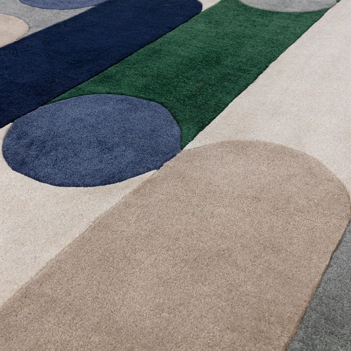 Asiatic Romy Morse Blue Designer Rug featuring abstract curved shapes in Morse Blue, navy and beige on ivory background, Asiatic Carpets London