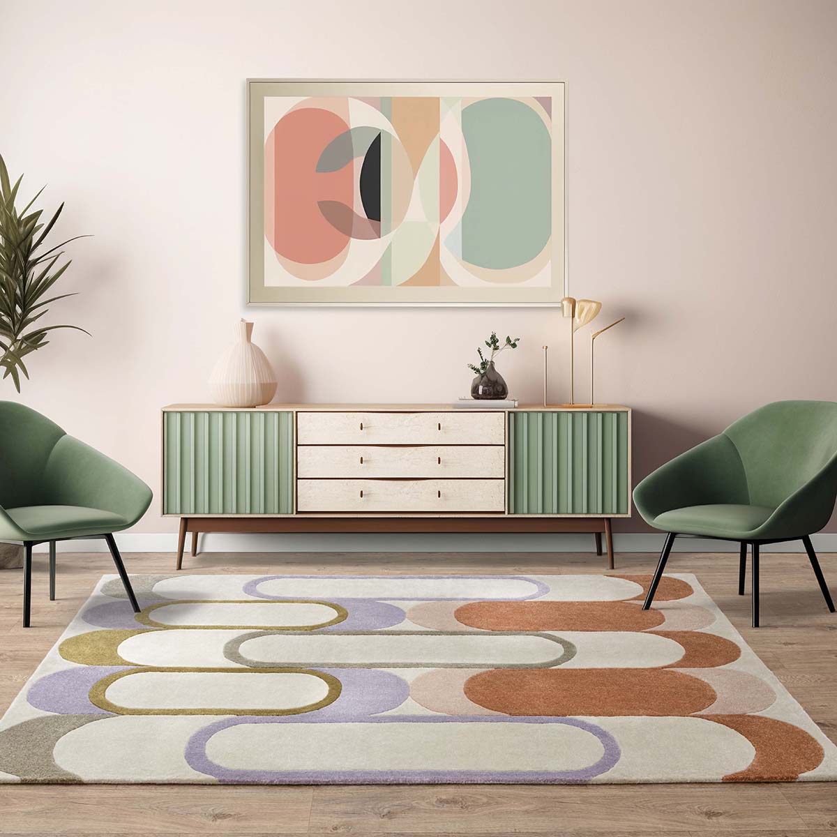 Modern living room with a colorful abstract rug, green chairs, and a sideboard.