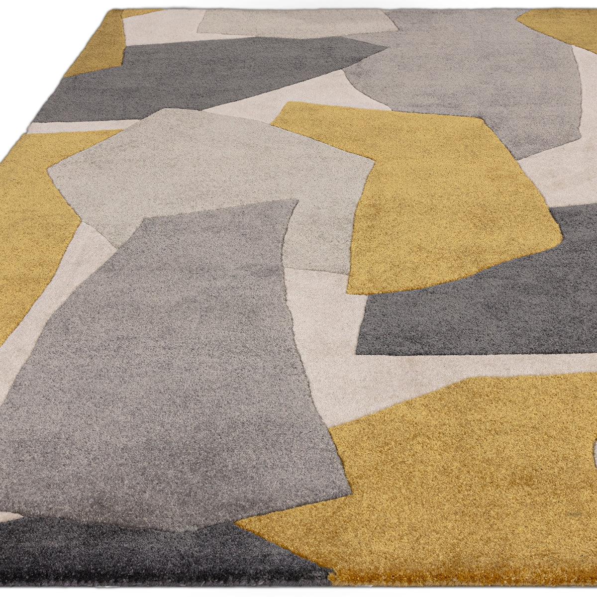 Asiatic Romy 10 Element Ochre rug featuring abstract geometric patches in ochre, grey and cream on beige background, hand-tufted wool