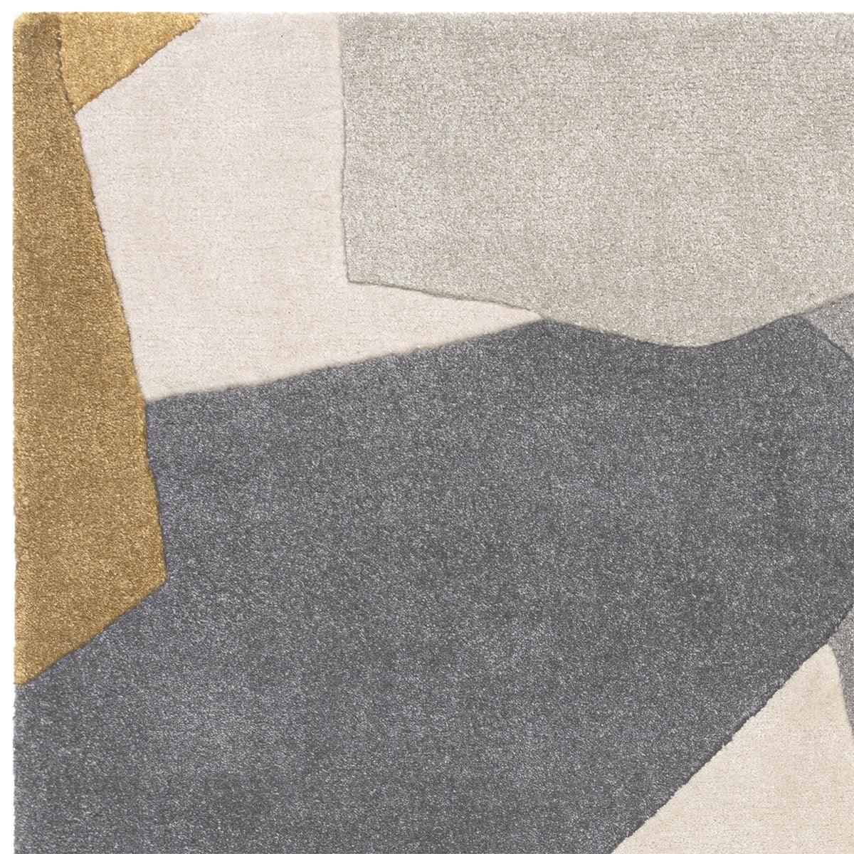 Asiatic Romy 10 Element Ochre rug with abstract geometric patchwork in ochre, ivory, beige, light grey and charcoal on light beige background