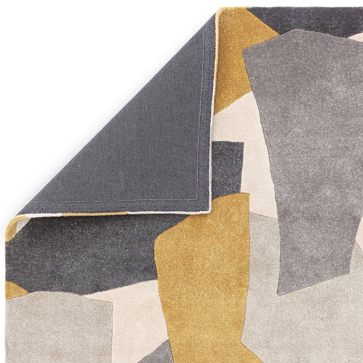 Asiatic Romy 10 Element Ochre rug featuring abstract geometric blocks in ochre, charcoal, grey, cream on beige background, machine-woven wool