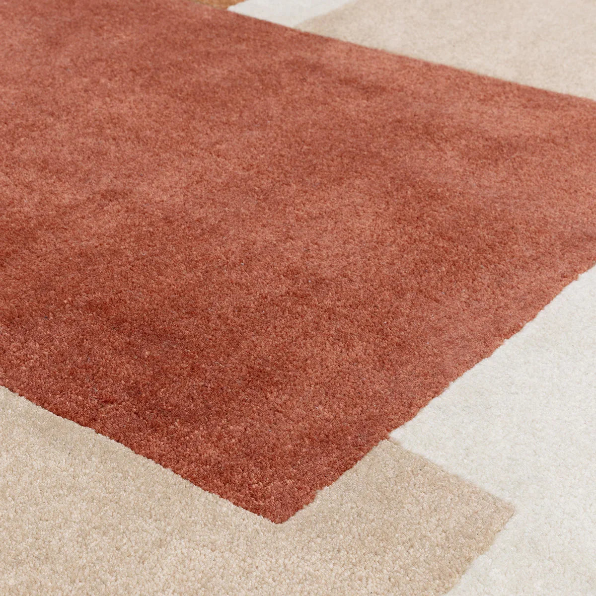 Asiatic Romy Papercut Red Designer Rug featuring papercut pattern in rust red on beige blocks, machine-made rug