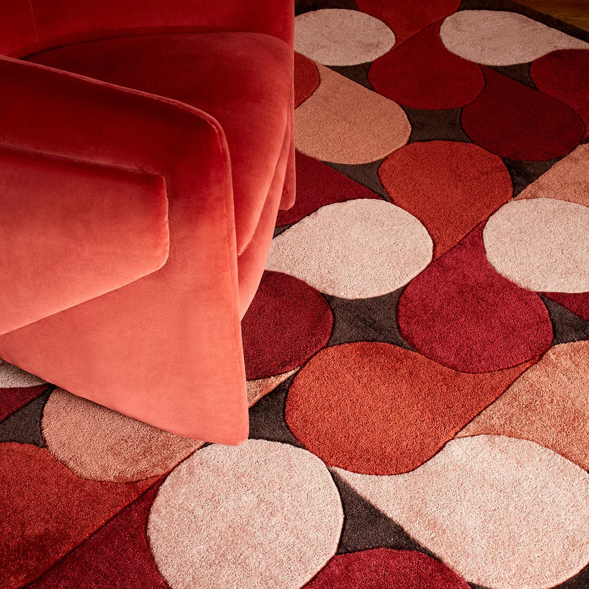 Asiatic Romy 14 Jive Red rug featuring circular dot pattern in crimson, burgundy, dusty rose and cream on charcoal, hand-tufted wool
