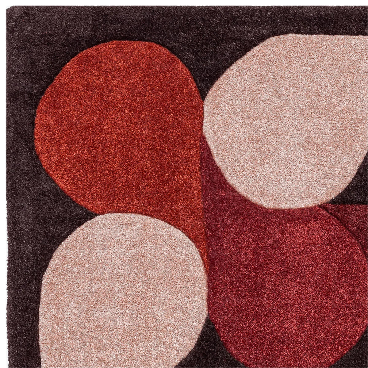Asiatic Romy Jive Red rug featuring abstract circular pattern in red, blush pink and burgundy on charcoal background