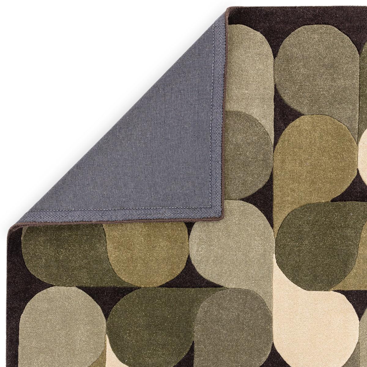 Asiatic Romy Jive Green rug featuring circular geometric pattern in olive, sage, taupe and cream on dark background, wool